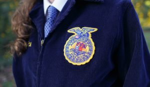 Girl wearing a blue FFA Jacket. Atlanta, GA. Future Farmers of America. Embroidered FFA emblem.